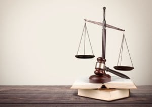 law scales on the table during a state pre-trial