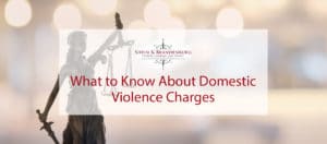 Featured image for a blog about domestic violence charges. The blog features a statue symbolizing law and justice.